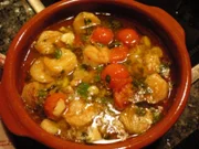 Garnelen in Knoblauchöl mit Cocktailtomaten - Rezept