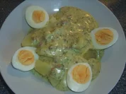 Eier in einer Käse-Speck Soße - Rezept
