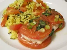 Schellfisch im Tomatenbett mit Reis - Rezept