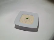 Geschäumte Consommé vom Sauren Zipfel auf Fencheleinlage - Rezept