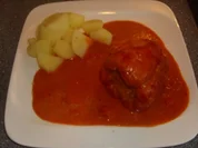 Gefūllte Paprikaschoten in Tomaten-Kåse Sauce - Rezept