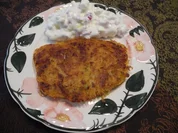 Kartoffel-Röstis mit Karottentrester an gewürfelten Ziegenkäse in Zwiebelquark nach Budwig - Rezept