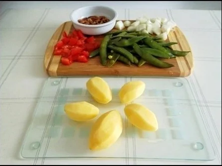 Rezept: Kalbsbraten mit Mini Knackerbsen und tournierten Kartoffeln dazu Bild Nr. 9 Kalbsbraten mit Mini Knackerbsen und tournierten Kartoffeln dazu - Rezept - Bild Nr. 9