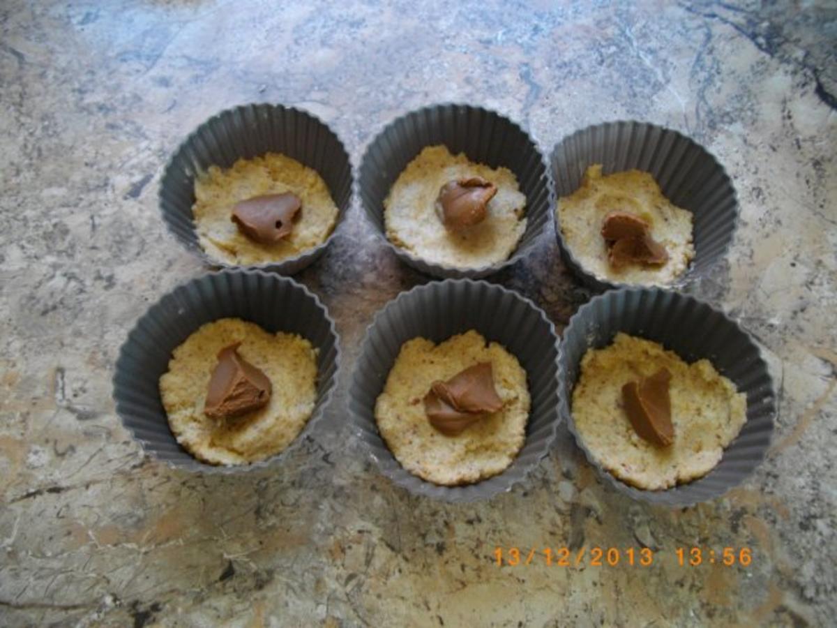 Bilder für Nuß Kokos Muffins mit Nugat gefüllt - Rezept