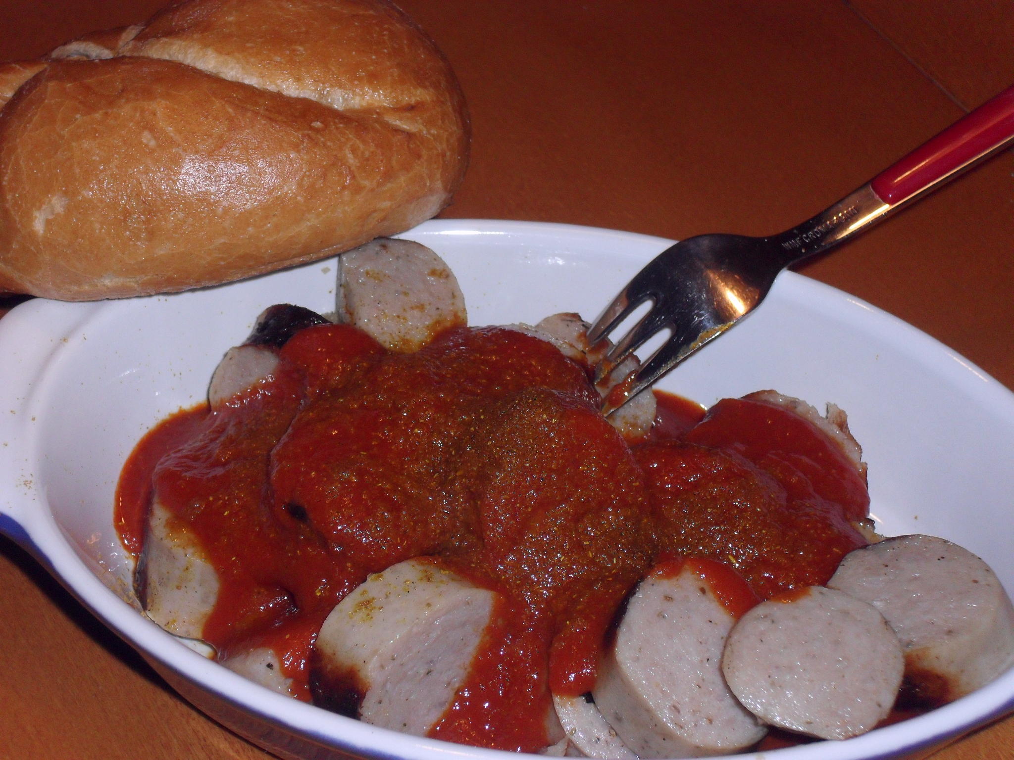 Bilder für Currywurst mit Orangensaft und Knoblauch - Rezept