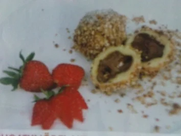 Rezept: Nougatknödel mit Nuss- oder Mandelbröseln Nougatknödel mit Nuss- oder Mandelbröseln - Rezept