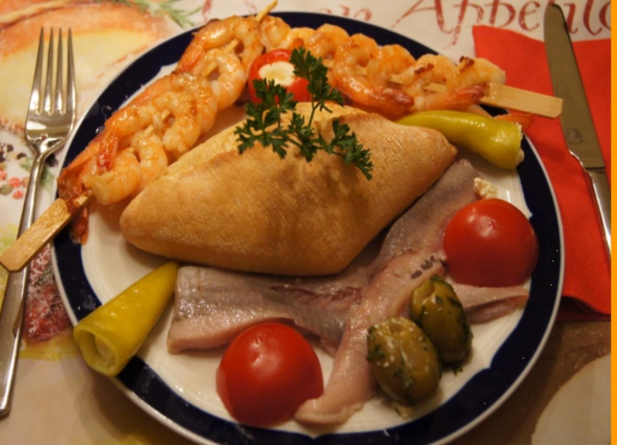 Bilder für Garnelenspieße mit Matjesfilet und Antipasta - Rezept