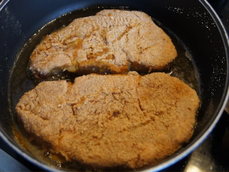 Rezept: Panierte Schweinenackensteaks mit Zwiebelringen, Weißkraut und Kartoffeln Bild Nr. 1144 Panierte Schweinenackensteaks mit Zwiebelringen, Weißkraut und Kartoffeln - Rezept - Bild Nr. 1144