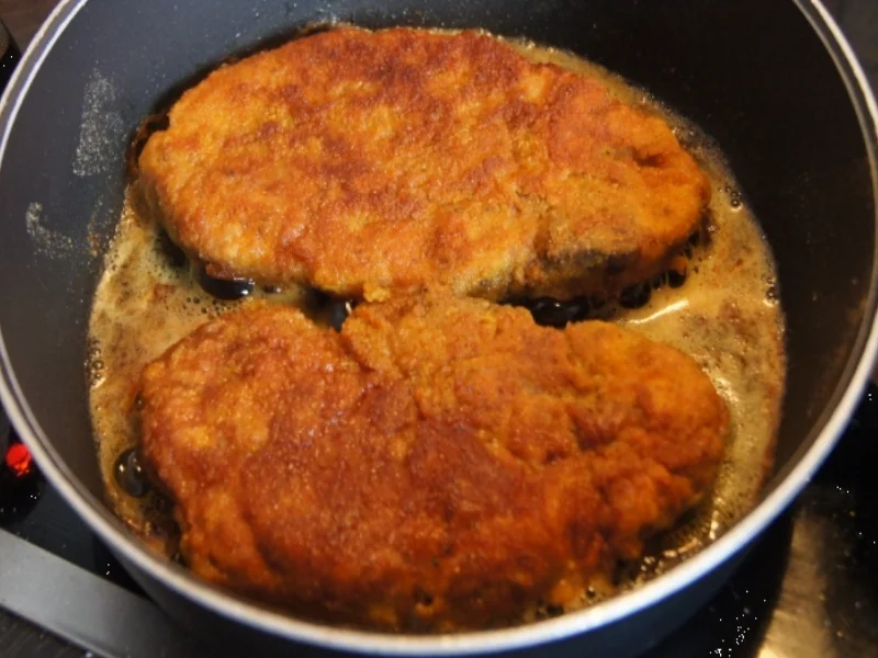 Rezept: Panierte Schweinenackensteaks mit Zwiebelringen, Weißkraut und Kartoffeln Bild Nr. 1145 Panierte Schweinenackensteaks mit Zwiebelringen, Weißkraut und Kartoffeln - Rezept - Bild Nr. 1145