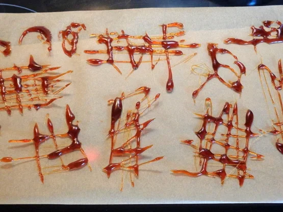 Glühwein-Panna Cotta mit Karamell-Gitter, Gewürz-Orangen auf Orangen-Zabaione ... - Rezept - Bild Nr. 4740