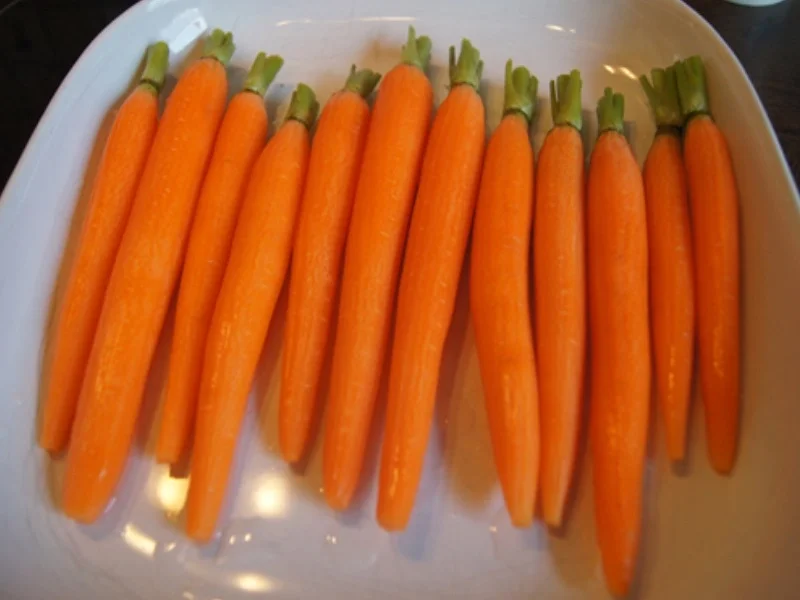 Wiener Schnitzel vom Schwein mit Honig-Bundmöhren und Sahne-Kartoffelstampf - Rezept - Bild Nr. 8