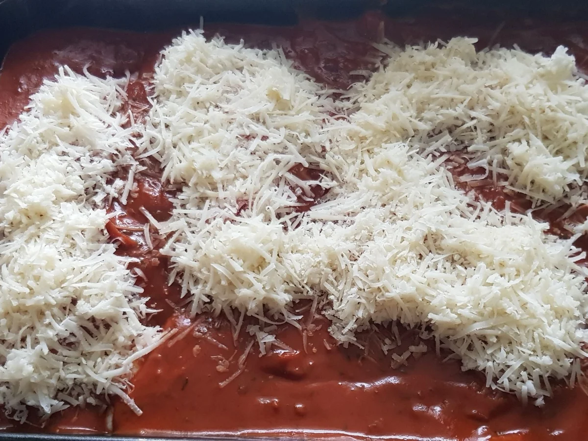 Parmesan-Hühnerschenkel in Tomaten-Rahmsoße - Rezept - Bild Nr. 13944