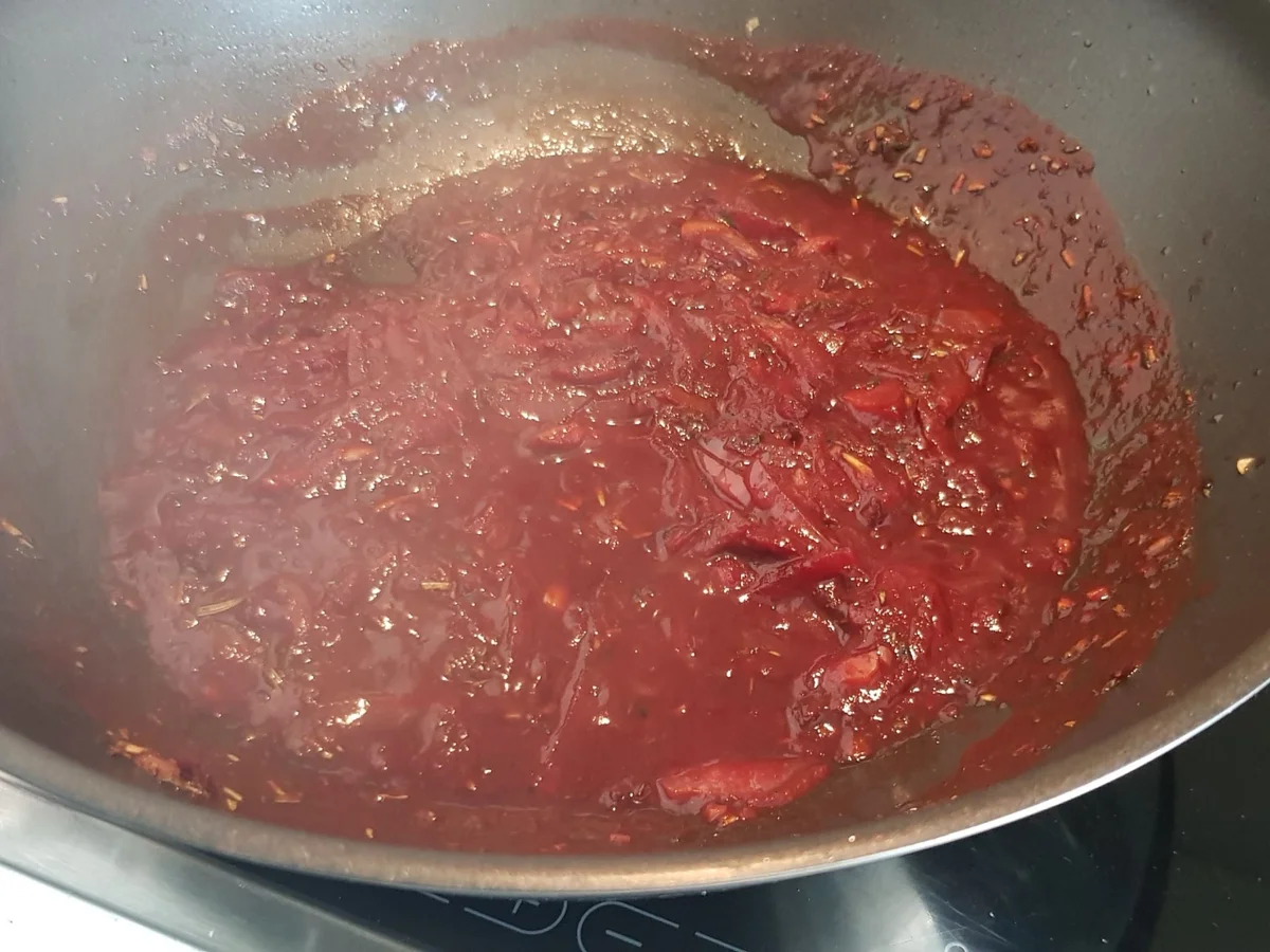 Parmesan-Hühnerschenkel in Tomaten-Rahmsoße - Rezept - Bild Nr. 13947