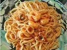 Spaghetti mit einer Soße aus Meeresfrüchten und Tomaten - Rezept