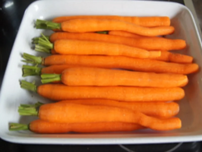 Schweinefiletschnitzel mit Champignon-Rahmsauce, Honig-Bundmöhren und Drillingen - Rezept - Bild Nr. 13