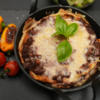 Steirische Lasagne mit Palatschinken, dazu geröstete Tomaten und Paprika - Rezept - Bild Nr. 17262