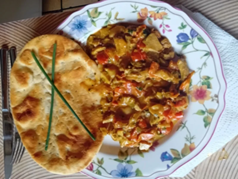 Schweinefilet-Steinpilz-Tomaten-Pfanne mit Naan Brot - Rezept - Bild Nr. 17507