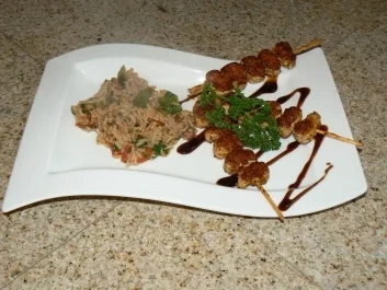 Reispfanne mit Putenspießen - Rezept