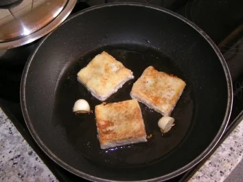 Dorsch auf Orangensosse mit Curryreis im Mandarinennest - Rezept