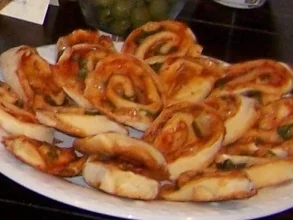 Rezept: Schnelle Pizza-Schnecken Schnelle Pizza-Schnecken - Rezept