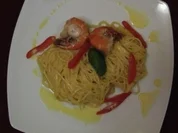 Scampi beschwipst auf Spaghettinest mit Sahne-Weißweinsoße und Trüffelöl - Rezept