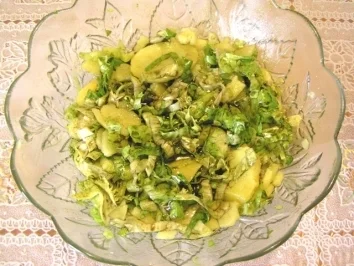 Zucchini mit Gemüse-Fleisch-Füllung mit Käse überbacken - Rezept