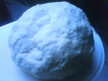Hausgemachte Knödel an Rahmspinat und Fischstäbchen - Rezept