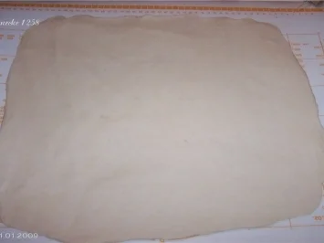 Pizza "nach Art des Hauses" - Rezept